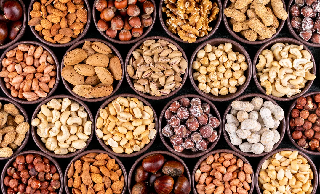 set-pecan-pistachios-almond-peanut-cashew-pine-nuts-lined-up-assorted-nuts-dried-fruits-mini-different-bowls (1)